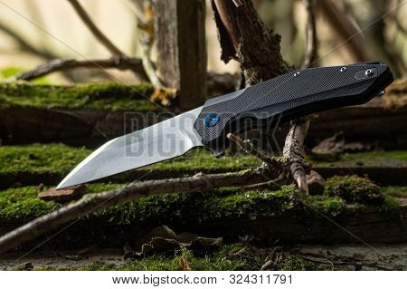 Foldable Pocket Knife For Everyday Use. With A Knife In Nature.