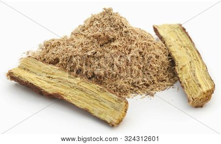Liquorice Stick And Ground Over White Background
