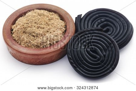 Liquorice Powdere With Candy Over White Background