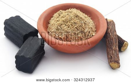 Liquorice Powdere With Candy Over White Background
