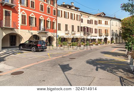 View Of Picturesque Village Morcote With Outdoor Bars And Gift Shops On The Shore Of Lake Lugano In