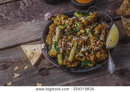 Close View Fried Cauliflower With Tahina Paste, Top View