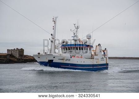 Hornafjordur Iceland - January 12. 2019:fishing Vessel Hvanney Entering Port Of Hornafjordur