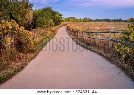early fall dusk over a bike trail -  multi uae Poudre River Trail in northern Colorado