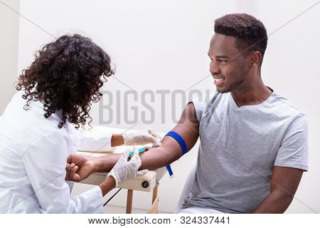 Doctor Taking Blood Sample