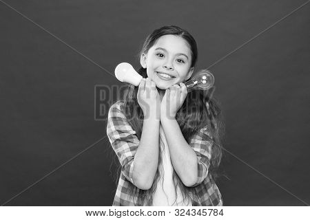 Girl Adorable Child With Long Hair Hold Light Bulbs. Idea And Creativity. Fresh Idea Of Youth Genera