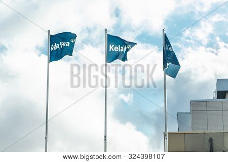 Kouvola, Finland - 22 September 2019: Flags Of Kela. Kela Is Finnish Social Insurance Institution.