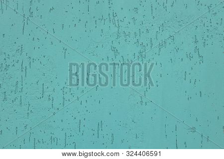 Top View Of Mint-colored Uneven Painted Wall Of Building