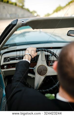 Young Businessman Goes To Classic American Cars. Automatic Texture