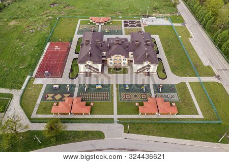 Aerial View Of New Prescool Building In Residential Rural Area.