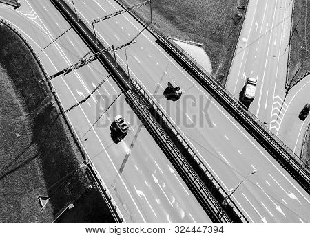 Aerial View Of Highway And Overpass In City. Aerial View Of Cars Crossing Interchange Overpass. High