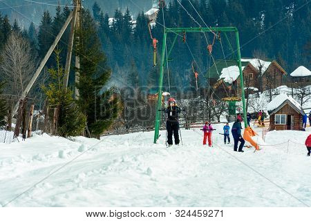 Yablunytsya, Ukraine February 5, 2019: Holidaymakers Rise On The Towbar.