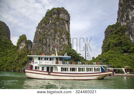 Halong Bay Traditional Fishing Boats, Unesco World Natural Heritage, Vietnam. Tourist Cruise Ships S