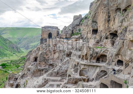 View Of The Cave City Vardzia. View From The Cave City To The River Valley And Green Slopes On A Sun