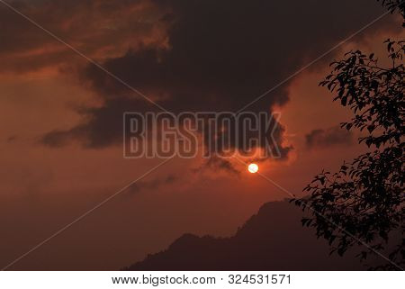 Mountain Landscape At Sunset At Bhutan Mountain. Amazing View On Colorful Clouds And Layered Mountai