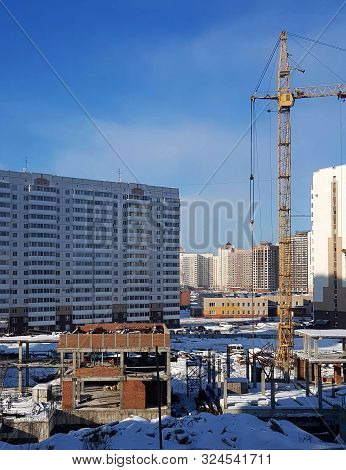 Novokuznetsk, Russia - February 2019. The Process Of Building New High-rise Buildings, Tower Cranes 