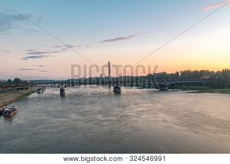 Swietokrzyski Bridge Over Vistula River At Sunrise Time In Warsaw, Poland.