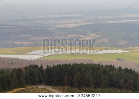 Solar Panel Farm In View Over Welsh Countryside With, The Vale Of Neath