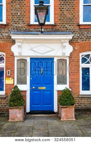 Blue Front Door Of Georgian Style House In Beaconsfield, Buckinghamshire, England