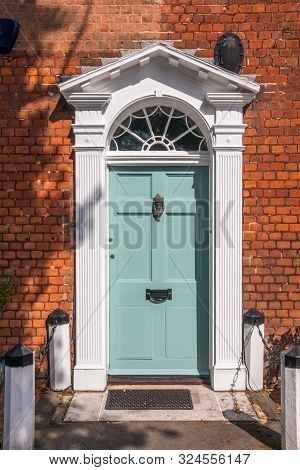 White Front Door Of Georgian Style House In Beaconsfield, Buckinghamshire, England