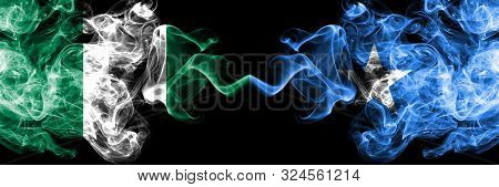 Nigeria Vs Somalia, Somalian Abstract Smoky Mystic Flags Placed Side By Side. Thick Colored Silky Sm