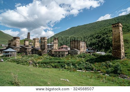 View Of The Ushguli Village At The Foot Of Mt. Shkhara. Picturesque And Gorgeous Scene. Rock Towers