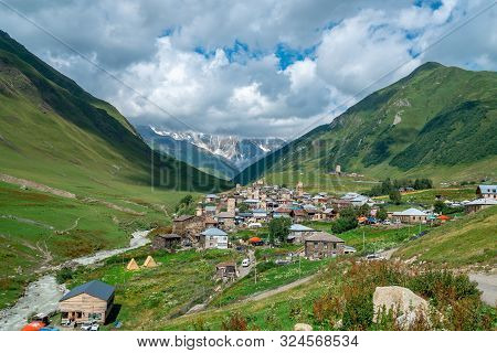 View Of The Ushguli Village At The Foot Of Mt. Shkhara. Picturesque And Gorgeous Scene. Rock Towers