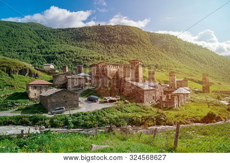 View Of The Ushguli Village At The Foot Of Mt. Shkhara. Picturesque And Gorgeous Scene. Rock Towers
