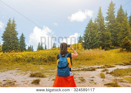 Woman Wanderlust Photographing Nature Landscape On Smartphone In The Forest. Young Female Taking Pho