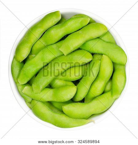 Edamame, Green Soybeans In The Pod, In White Bowl. Unripe Soya Beans, Also Maodou. Glycine Max, A Le