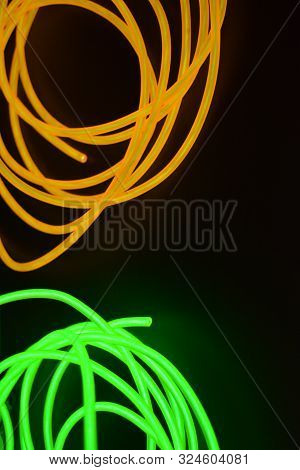 Bright Luminous Yellow And Green, Lime Neon Wires In Different Formats And Layouts. An Electrolumine