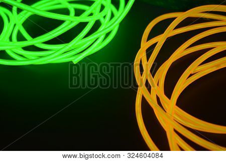 Bright Luminous Yellow And Green, Lime Neon Wires In Different Formats And Layouts. An Electrolumine
