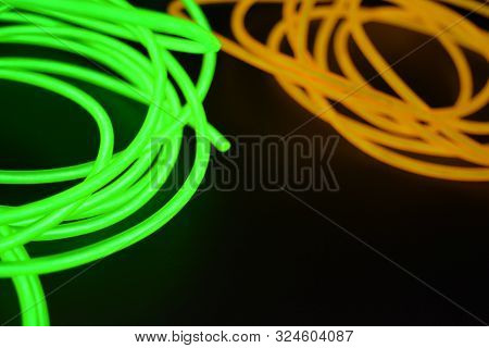 Bright Luminous Yellow And Green, Lime Neon Wires In Different Formats And Layouts. An Electrolumine