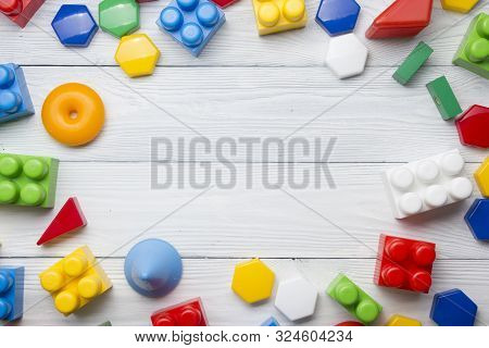 Kids Educational Developing Toys Frame On White Background. Top View. Flat Lay. Copy Space For Text