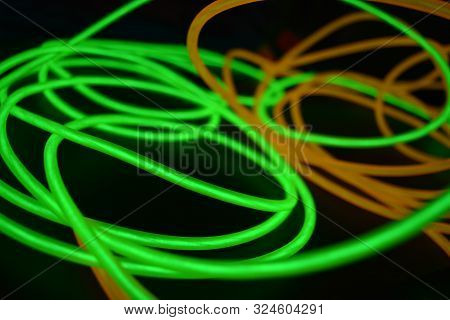Bright Luminous Yellow And Green, Lime Neon Wires In Different Formats And Layouts. An Electrolumine