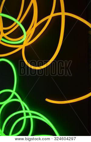 Bright Luminous Yellow And Green, Lime Neon Wires In Different Formats And Layouts. An Electrolumine