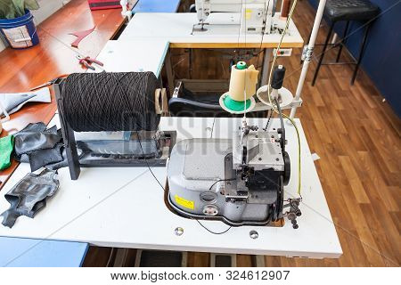 Professional Sewing Machine For Embroidery And Making Clothes In The Workshop.