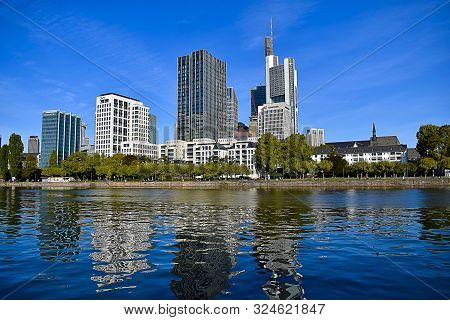 The Main River Of Frankfurt Am Main, In The Background Office Buildings.