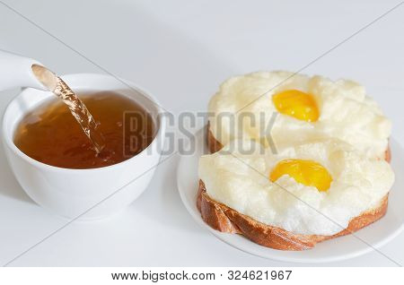 Hot Egg Sandwiches And Pour Tea For Breakfast. Selective Focus