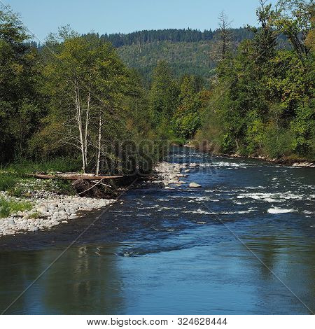 The Rocky And Rugged Shores Of The Middle Fork Of The Willamette River Near Oakridge Oregon Filled W