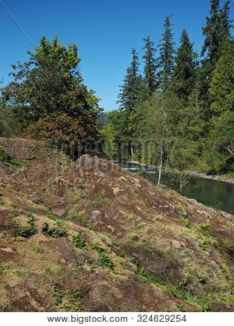 The Rocky And Rugged Shores Of The Middle Fork Of The Willamette River Near Oakridge Oregon Filled W