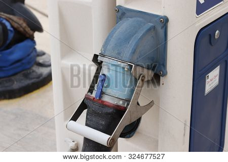 Charging Station For Boats, Electrical Outlets To Charge Ships In Harbor Seen Close Up.