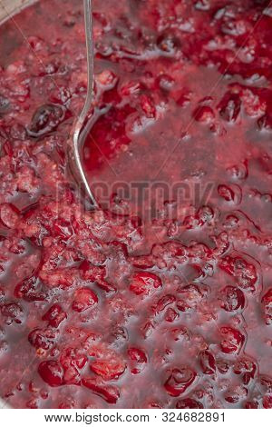 Crushed Red Cranberry Filled With Alcohol Before Cooking Tinctures