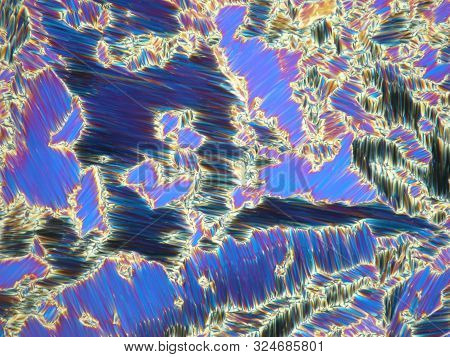 Liquid Crystal In Its Liquid Crystal State Under Polarized Light Microscope Forming A Blue Texture.