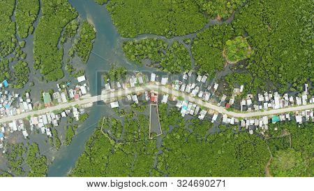 Highway Through The Mangrove Forest Passing Through The Village, Aerial View. Siargao Island, Philip