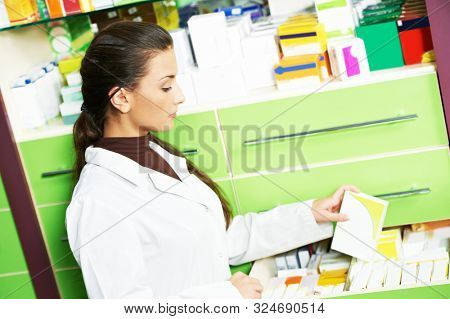 Female pharmacutical chemist at drugstore