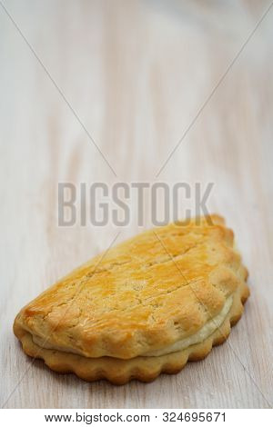 Freshly Baked Sochni. Wooden Background, High Resolution