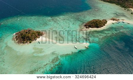 Aerial View Tropical Beach With White Sand And Clear Blue Sea. Tropical Landscape With Islands And B