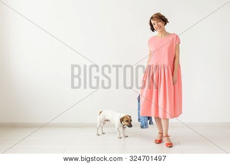 Pets Owner Concept - Young Woman In Pink Dress With Jack Russell Terrier Dog Over The White Backgrou