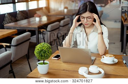 Freelance Asian Woman Headache Tired,stess Or Deadline With Digital Laptop Computer Working On Workp